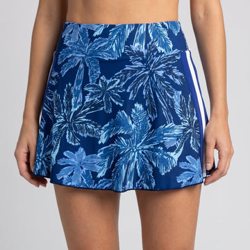 a woman wearing a blue skirt