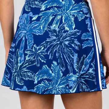 a woman wearing a blue skirt