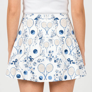 Skirt with tennis racket and floral pattern on a white background