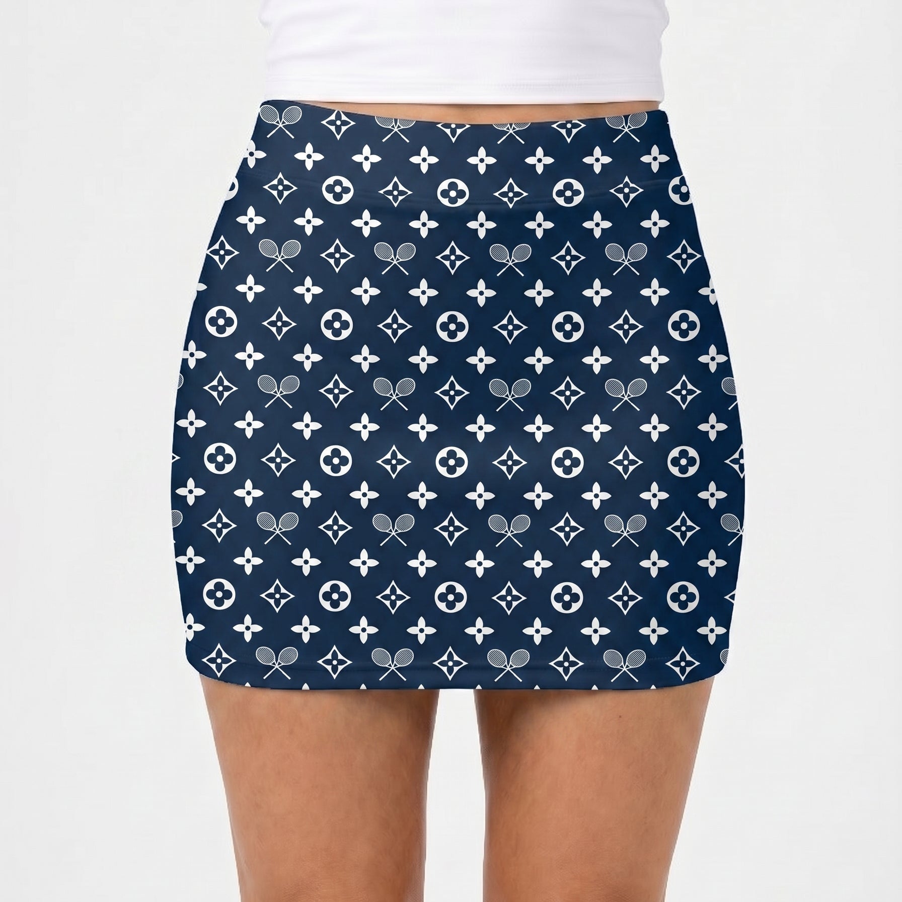 Navy blue skirt with white pattern worn by a person on a white background