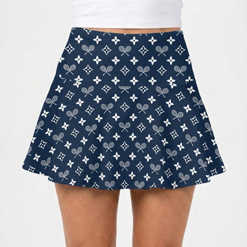 Navy blue skirt with tennis racket pattern worn by a person on a white background