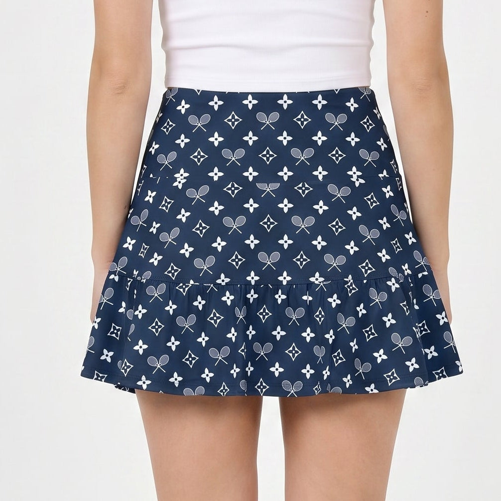 Person wearing a navy blue patterned skirt on a white background