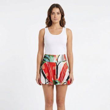 women waring red green and black tennis skirt
