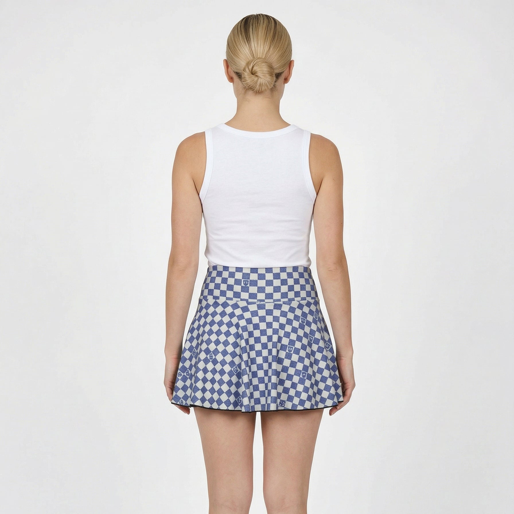 woman in navy and white checkered tennis skirt