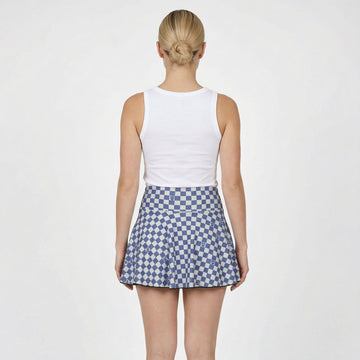 woman in navy and white checkered tennis skirt